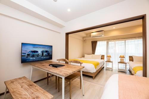 Μια τηλεόραση ή/και κέντρο ψυχαγωγίας στο Tomariehotel & condominium
