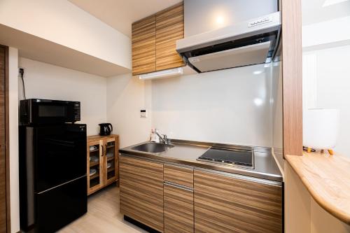 Η κουζίνα ή μικρή κουζίνα στο Tomariehotel & condominium