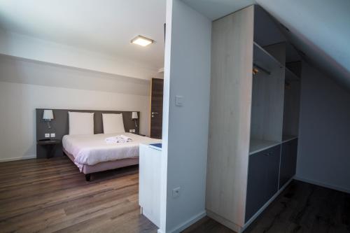 Кровать или кровати в номере Hôtel Restaurant Kuentz