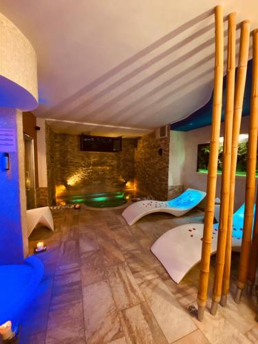 a room with a bed and a stone wall at Aurelia Garden Gold B&B in Rome
