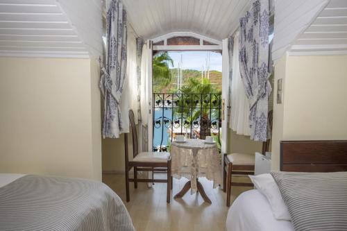Postel nebo postele na pokoji v ubytování Hotel Villa Daffodil