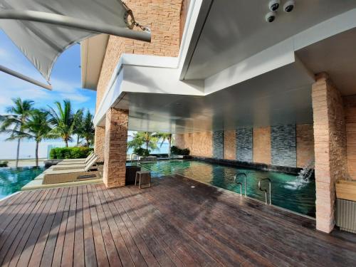 an indoor swimming pool in a house at Modala Beach Resort in Panglao