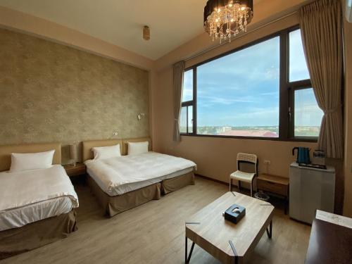 Postel nebo postele na pokoji v ubytování IN99 Hotel