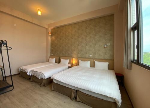 Postel nebo postele na pokoji v ubytování IN99 Hotel