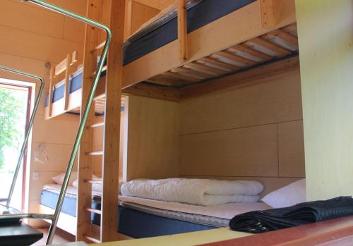 a bedroom with two bunk beds in a room at Kyst- og Fjordcentret in Ørsted
