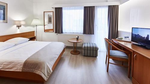 Postel nebo postele na pokoji v ubytování Hotel Francais