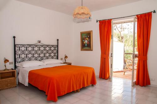 Ένα ή περισσότερα κρεβάτια σε δωμάτιο στο Hotel Punto Azzurro