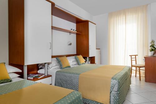 Postel nebo postele na pokoji v ubytování Hotel Principe