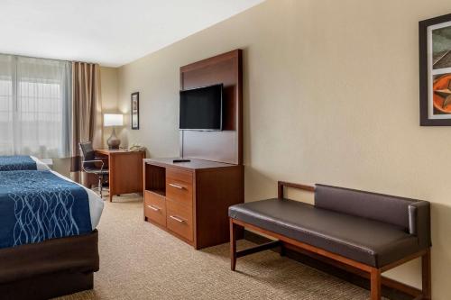 a hotel room with a bed and a desk at Comfort Inn & Suites Texas Hill Country in Boerne