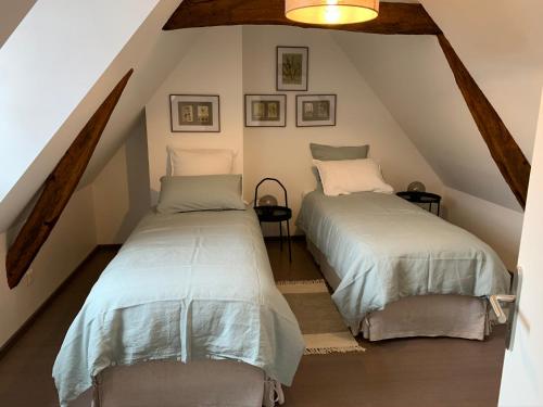 Postel nebo postele na pokoji v ubytování Les hauts de campagne