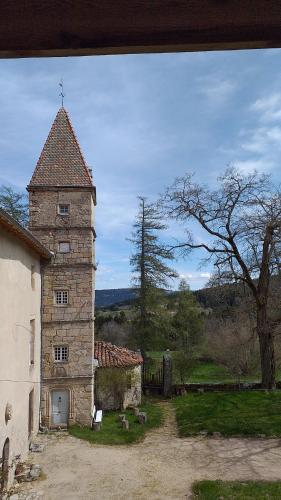 an old building with a cross on top of it at Gite de Folgoux in Malvières
