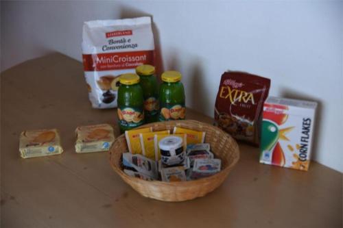 a basket with food and drinks on a table at Cianbolpin Guesthouse in Canazei