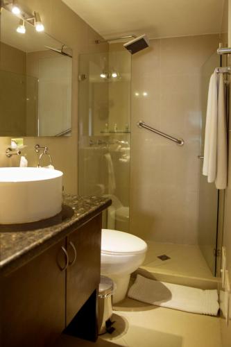 a bathroom with a sink and a toilet and a shower at Hotel Santa Cecilia B&B in Cartagena de Indias