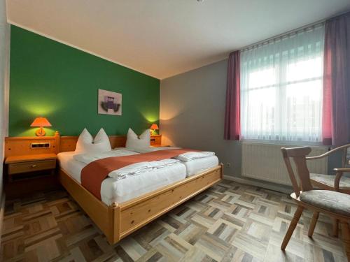 Ένα ή περισσότερα κρεβάτια σε δωμάτιο στο Landgasthaus Zander