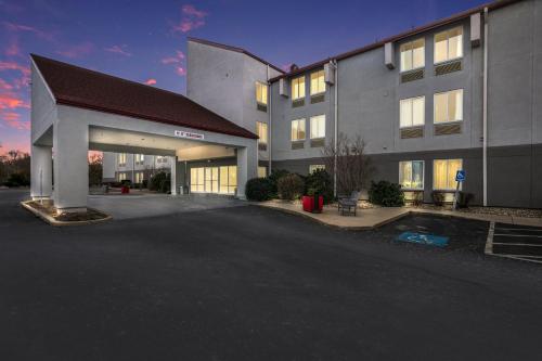 an empty parking lot in front of a building at Red Roof Inn PLUS+ Boston - Logan in Saugus
