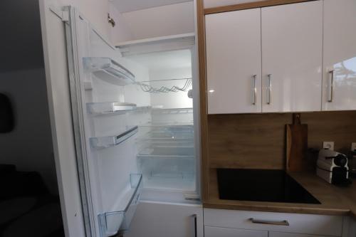 Kuchyň nebo kuchyňský kout v ubytování Nowe kameralne Apartamenty Graniczna2G Niechorze - sosnowy las i bardzo blisko plaży