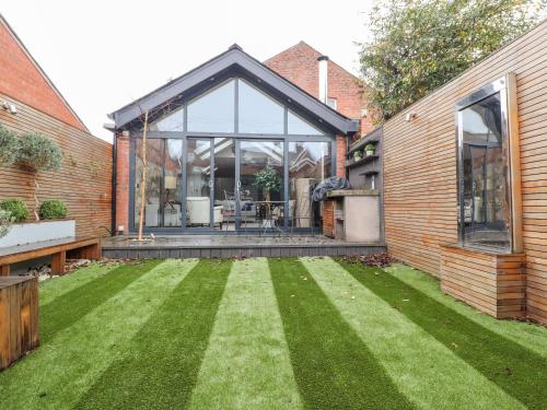 an internal view of a house with a lawn at Westwood House in Lytham St Annes