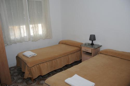 Pensión Iglesias tesisinde bir odada yatak veya yataklar