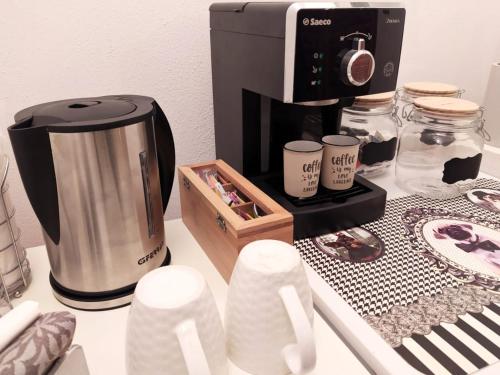 a counter top with a coffee maker and a coffee pot at A due passi dal mare in Moneglia