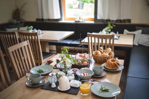 a table with food and bread on top of it at Schusterhof Dölsach in Dölsach