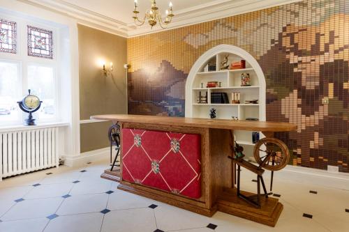a room with a counter with a table in it at Mercure Blackburn Dunkenhalgh Hotel & Spa in Blackburn
