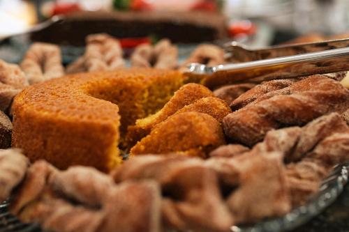a bunch of different types of food on a table at Boulevard Beach Canasvieiras Hotel in Florianópolis