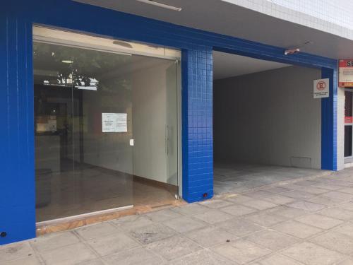 an open door of a building with blue bricks at Pousada Maré Mansa in Maceió