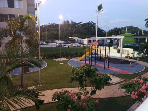 a playground in a park in a city at Piscina & Descanso - Puerto Azul- con todas las comodidades! in Ricaurte