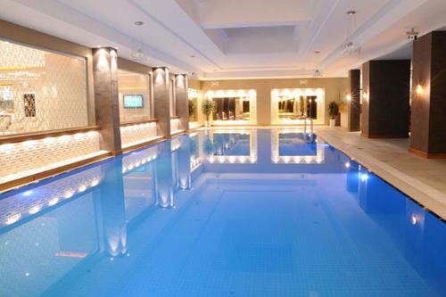 a large swimming pool in a hotel room at Mister Istanbul Hotel & Spa in Istanbul
