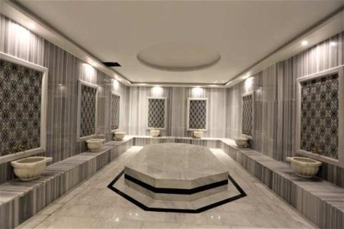 a bathroom with a large tub in the middle of a room at Mister Istanbul Hotel & Spa in Istanbul
