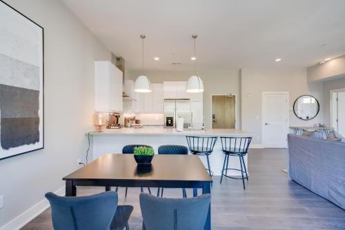 a kitchen and dining room with a table and chairs at Mason Lofts at West End in Nashville