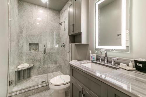 a bathroom with a shower and a toilet and a sink at The Pelican in New Orleans