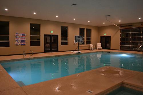 a large swimming pool with a tv in a building at Canyon Country Lodge in Escalante