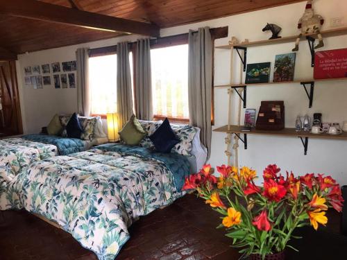 A bed or beds in a room at La Isabela Estancia Ecuestre