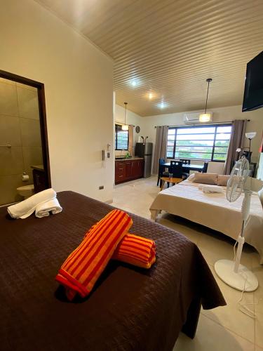 Ένα ή περισσότερα κρεβάτια σε δωμάτιο στο Beach Break Santa Teresa Apartamentos