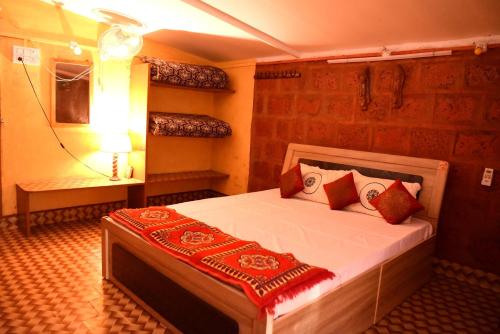 a bedroom with a large bed in a room at Turtle Beach House in Vengurla