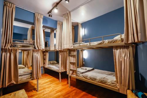 a room with a bunch of bunk beds at Green Island Ocean Rhythem dive B&B 綠島海韻民宿 in Green Island