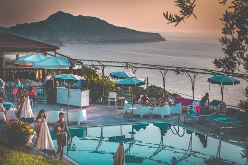 a swimming pool with a view of the ocean at Gocce Di Capri Resort in Massa Lubrense