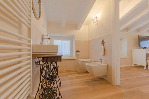 a bathroom with a sink and a toilet at Il cantuccio sul Garda - Relais di charme in Cavaion Veronese