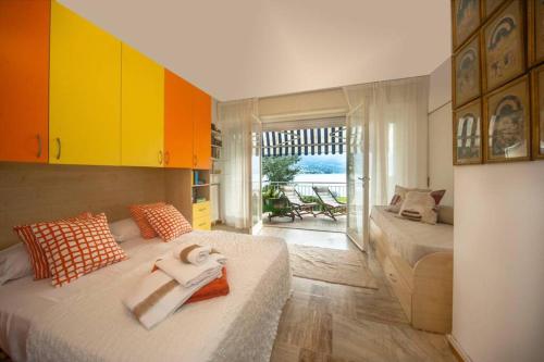 a bedroom with two beds and yellow cabinets at Casa Rodella in Marone