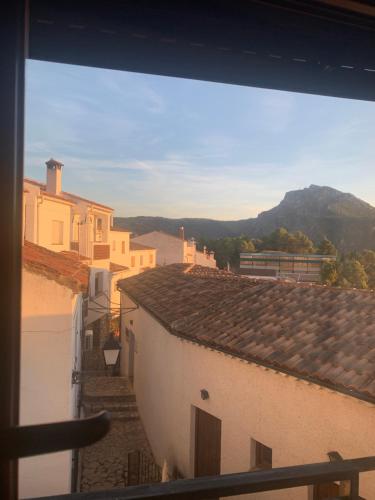 a view from a window of a city with buildings at Apartamentos Rurales Peralta in Segura de la Sierra