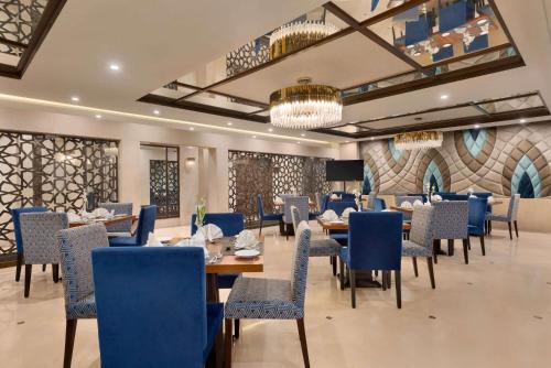 A restaurant or other place to eat at Ramada by Wyndham Lahore Gulberg II