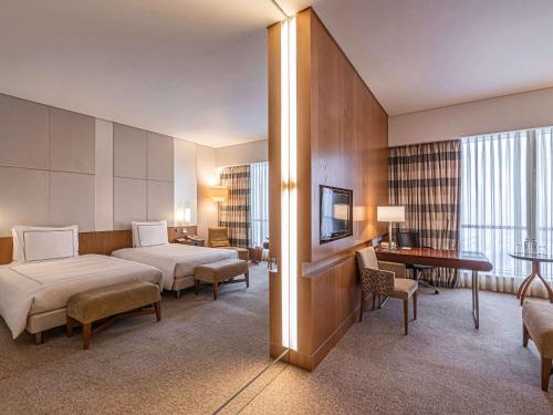 מיטה או מיטות בחדר ב-Swissotel Krasnye Holmy