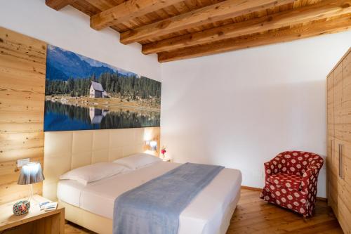 Un pat sau paturi într-o cameră la Palazzo Lodron Bertelli. Dimora Storica & Spa