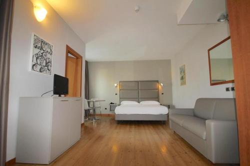 Postel nebo postele na pokoji v ubytování Hotel Rubicone