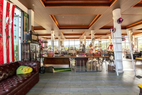 a living room with a couch and a table at Khao Kho Wanwarn in Phetchabun