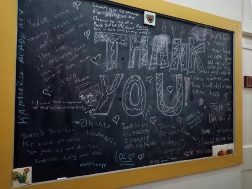 a chalkboard with the word truth written on it at Lighthouse Farm Backpackers Lodge in Cape Town