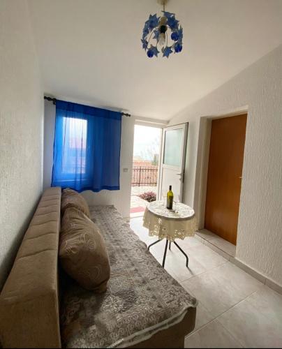 a living room with a couch and a table at Apartmani Vila Marija in Budva