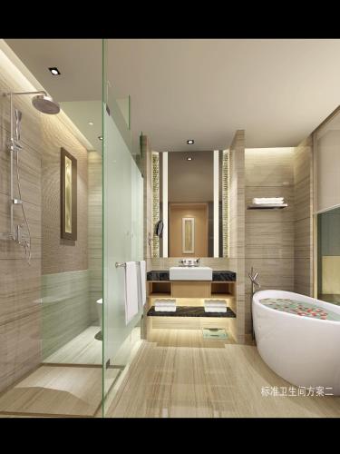 a bathroom with a tub and a sink at Grand Skylight International Hotel Ganzhou Chang Zhen Avenue in Ganzhou