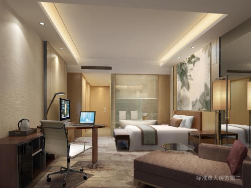 a hotel room with a bed and a desk at Grand Skylight International Hotel Ganzhou Chang Zhen Avenue in Ganzhou